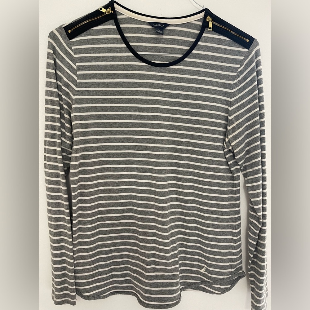Nautica women's top in a white and grey striped pattern with shoulder zippers